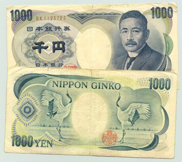 Japanese-Yen-JPY-1000-bank-notes-with-kanji-and-the-words-Nippon-Ginko-worn-front-and-back