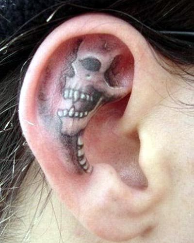 ear tattoo of skull