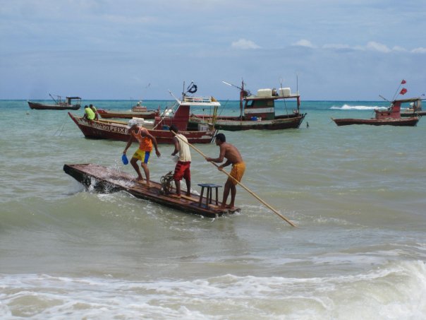 Fishermen going out to sea in Lagoa Azeda, Brazil