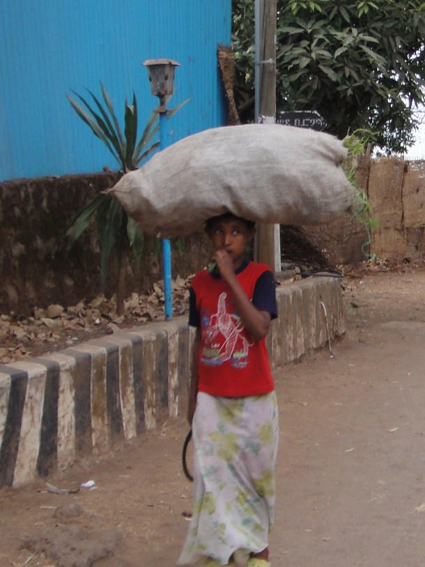 carrying goods on his head in Bahir Dar