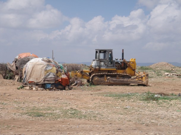hut next to bulldozer in jijiga