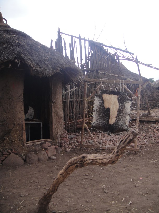 hide being stretched next to huts in Lalibela
