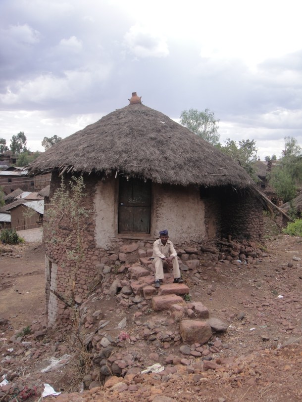 guard in front of hut in Lalibela