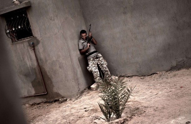 libyan-rebel-under-fire-josh-village
