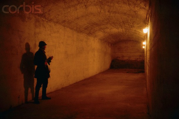 A Romanian soldier guarding a passageway in the underground tunnel used by notorious Romanian secret police, or , in the House of the People days after the December 1989 uprising, which marked the end of dictator Nicolae Ceausescu's rule. In a brief but violent revolution that spread from Timisoara to Bucharest, during which more than 1,200 people died, Ceausescu and his regime were overthrown and the dictator and his wife Elena summarily executed by firing squad.