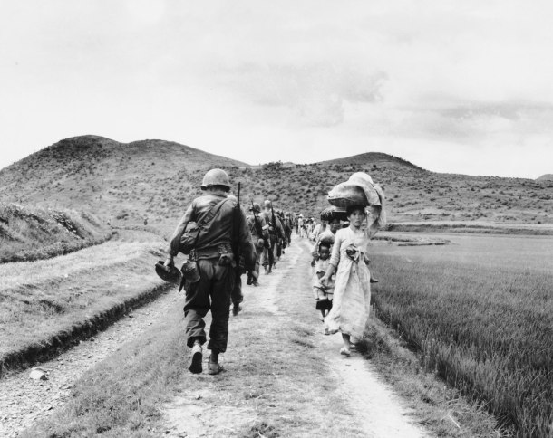 americans-passing-refugees-korean-war