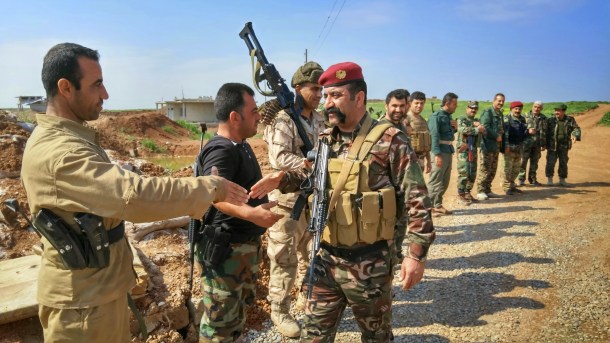kurdish-peshmerga-fighters-gather-in-formation-to-greet-visiting-officer