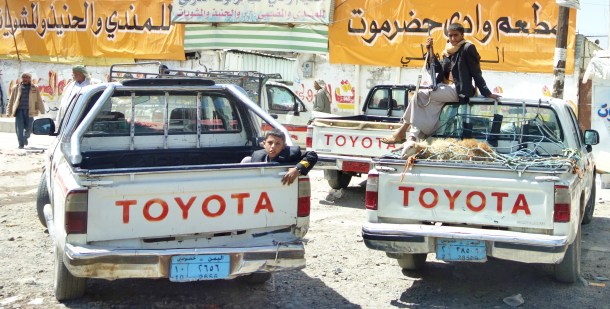 a-young-boy-watches-over-the-family-toyota-in-a-village-in-yemens-countryside-of-course-in-a-country-where-almost-everyone-knows-how-to-use-weapons-children-with-ak-47s-are-a-common-sight