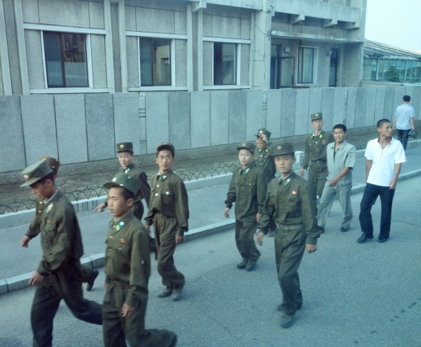 Despite the tremendous cost, North Korea has one of the largest militaries in the world when measured by the number of active-duty soldiers (and the largest paramilitary force in the world, representing 25% of the population).  As such, one frequently sees more soldiers than civilians when traveling through North Korea.